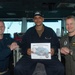 U.S Sailor receives Sailor of the day award
