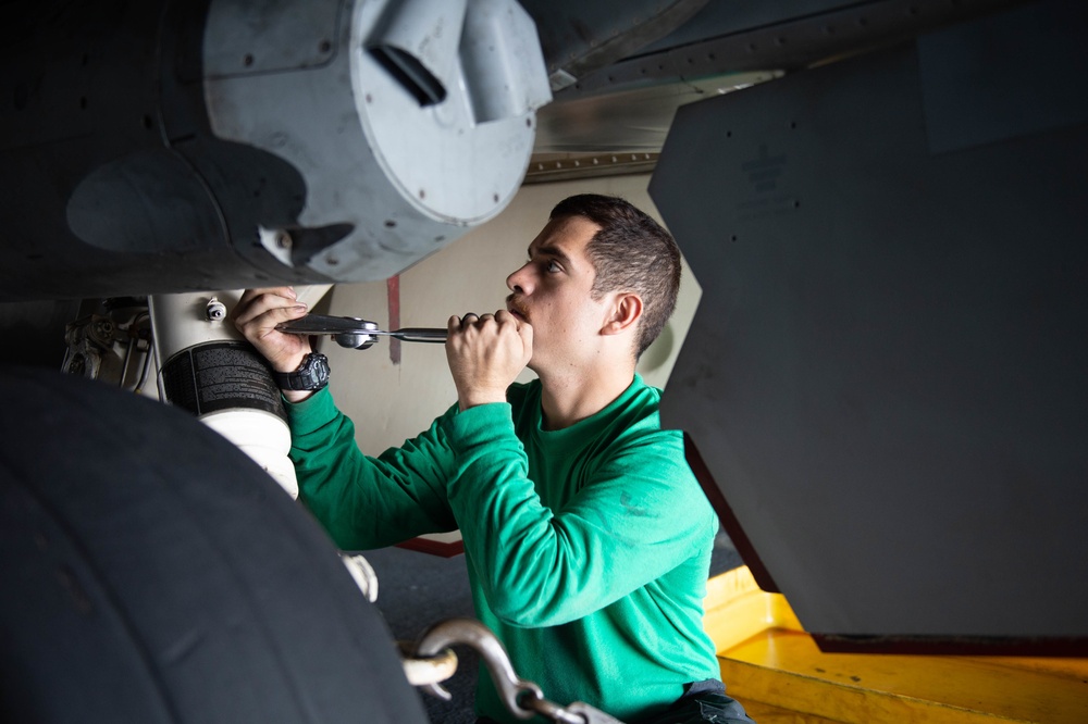 U.S. Sailor installs an infrared pod