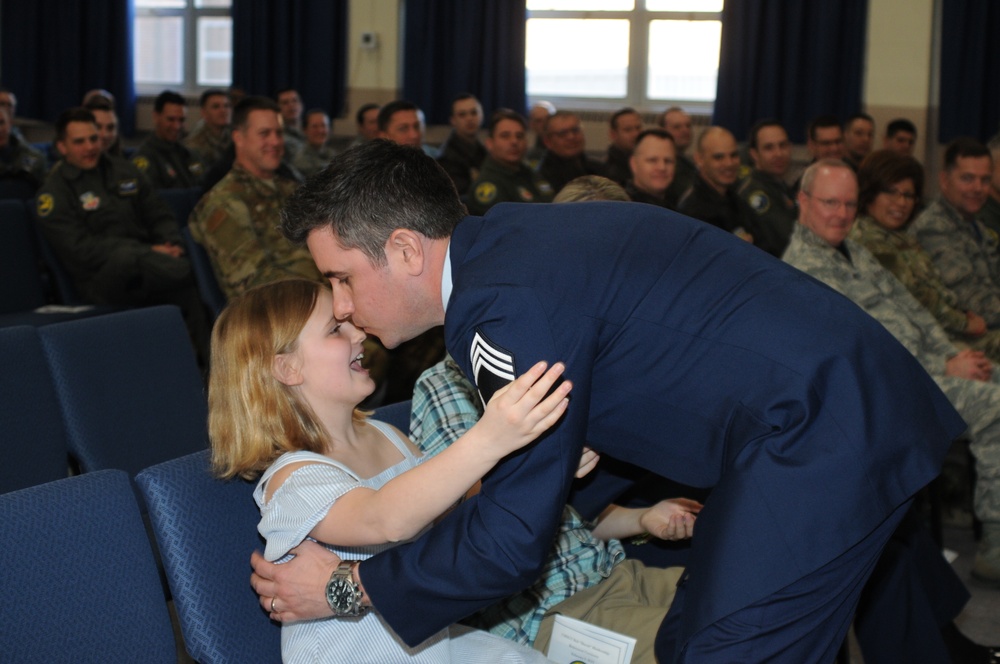 Retiring Chief hugs daughter during ceremony