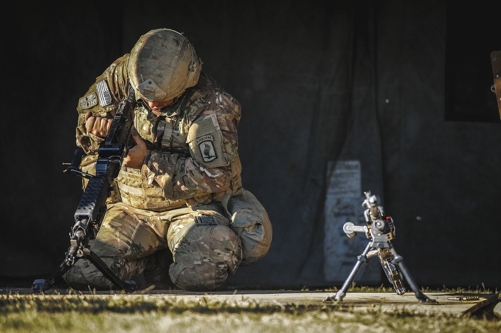 Paratrooper assembles weapon