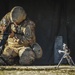 Paratrooper assembles weapon