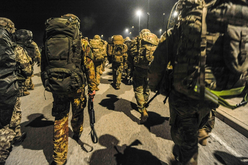 Soldiers prepare to ruck
