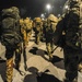 Soldiers prepare to ruck