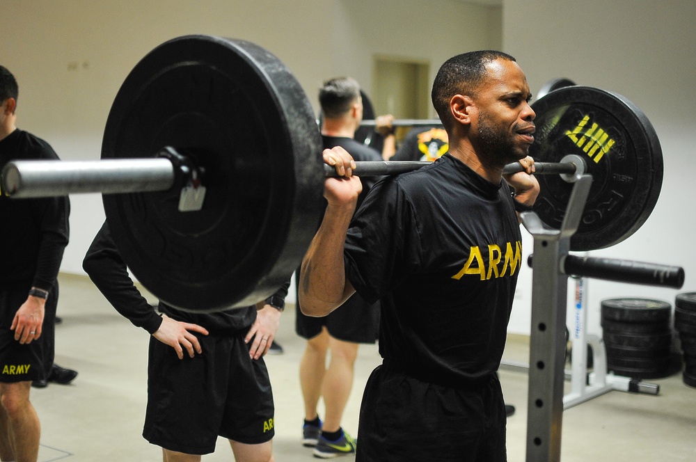 Paratrooper prepares to squat