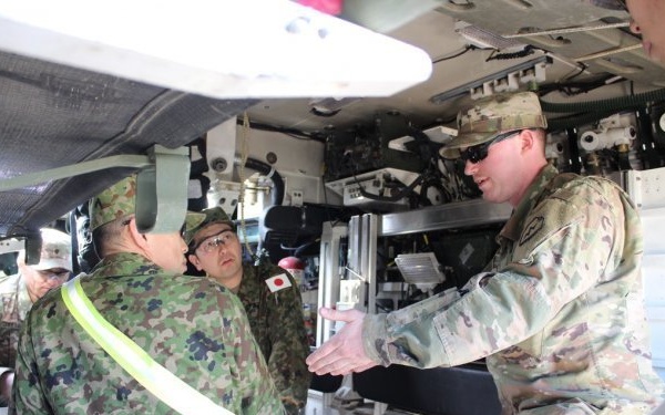 Japanese Soldiers Exchange Medical Expertise with Arctic Wolves