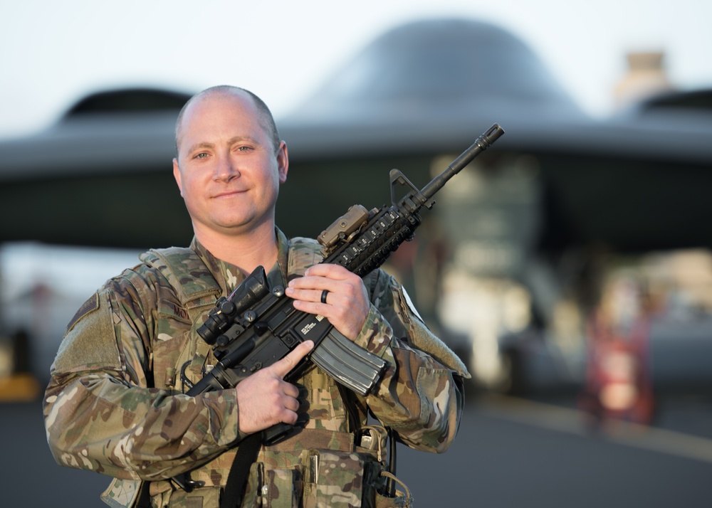 Security Forces Airman guards B-2 Spirit Stealth Bomber at Joint Base Pearl Harbor-Hickam