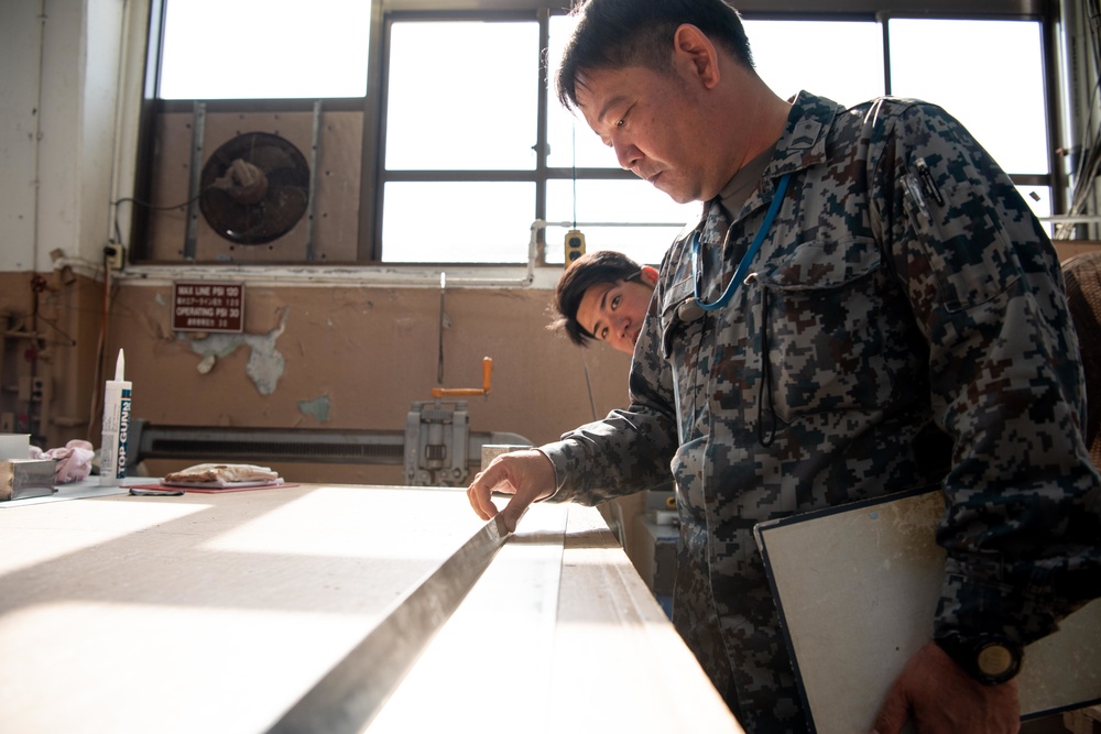 JASDF members and 18th CES Airmen exchange techniques