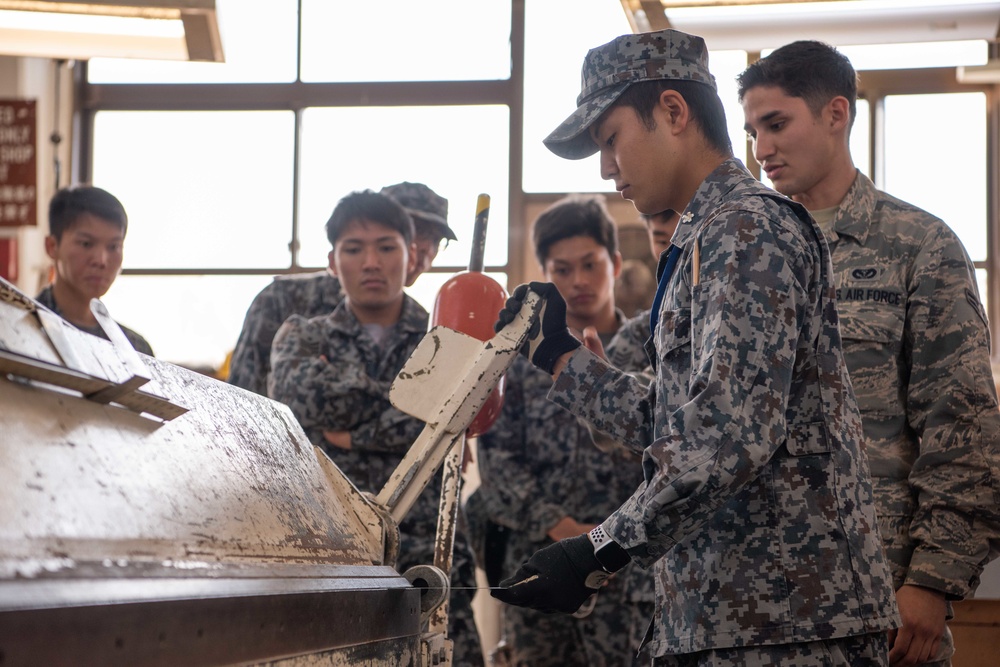 JASDF members and 18th CES Airmen exchange techniques