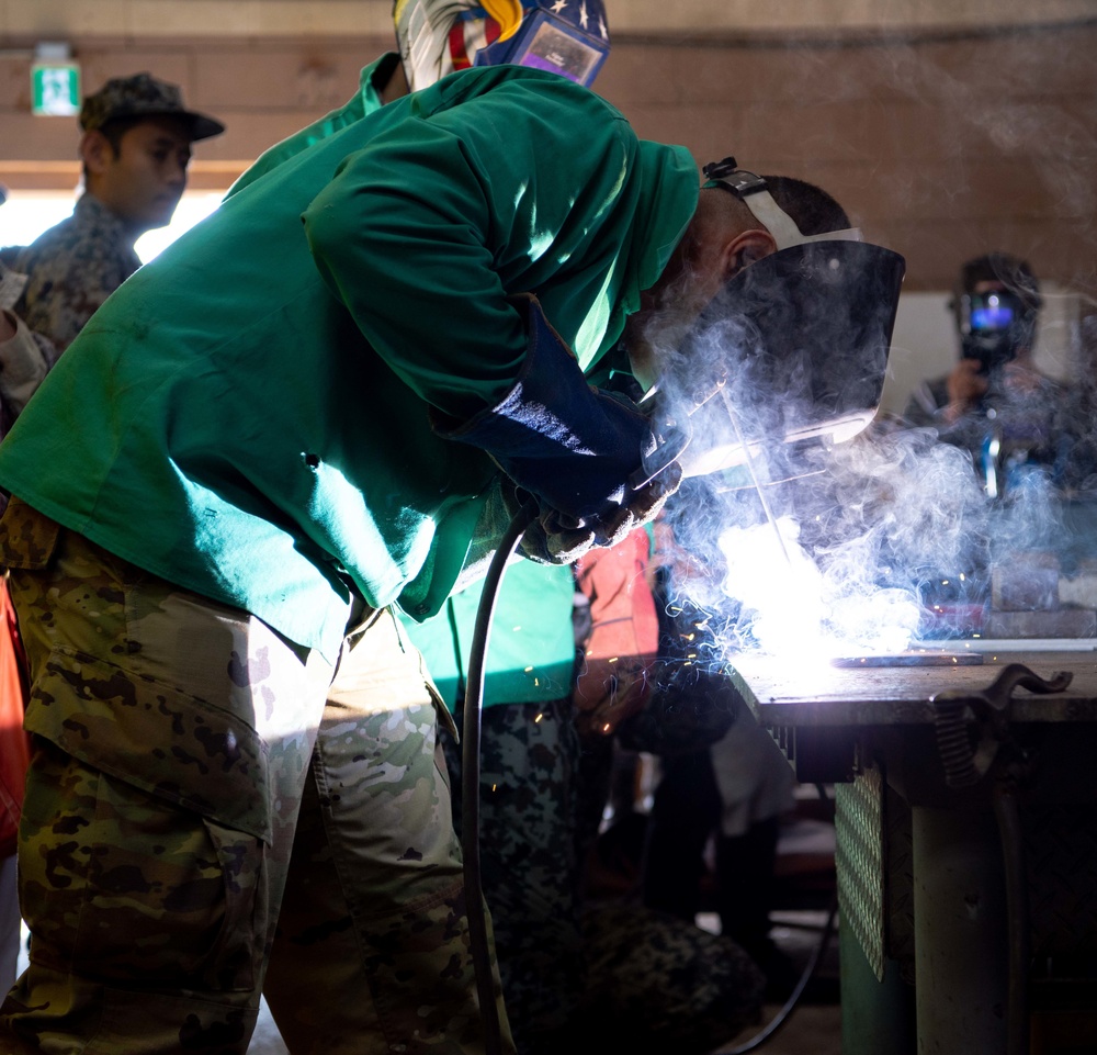 JASDF members and 18th CES Airmen exchange techniques