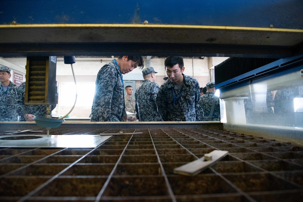 JASDF members and 18th CES Airmen exchange techniques