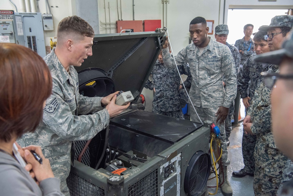 JASDF members and 18th CES Airmen exchange techniques