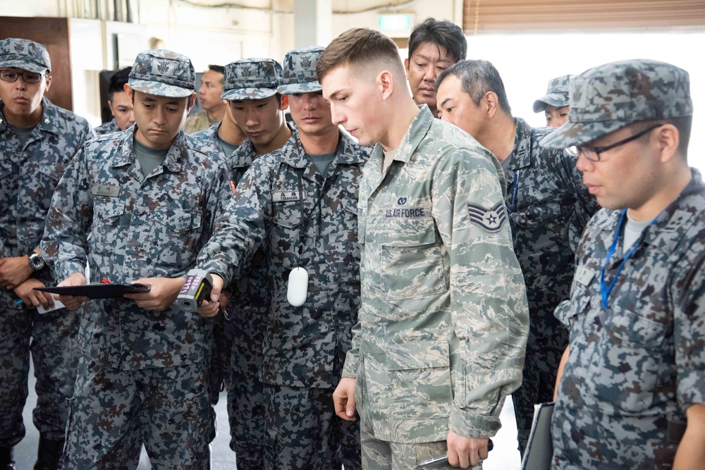JASDF members and 18th CES Airmen exchange techniques