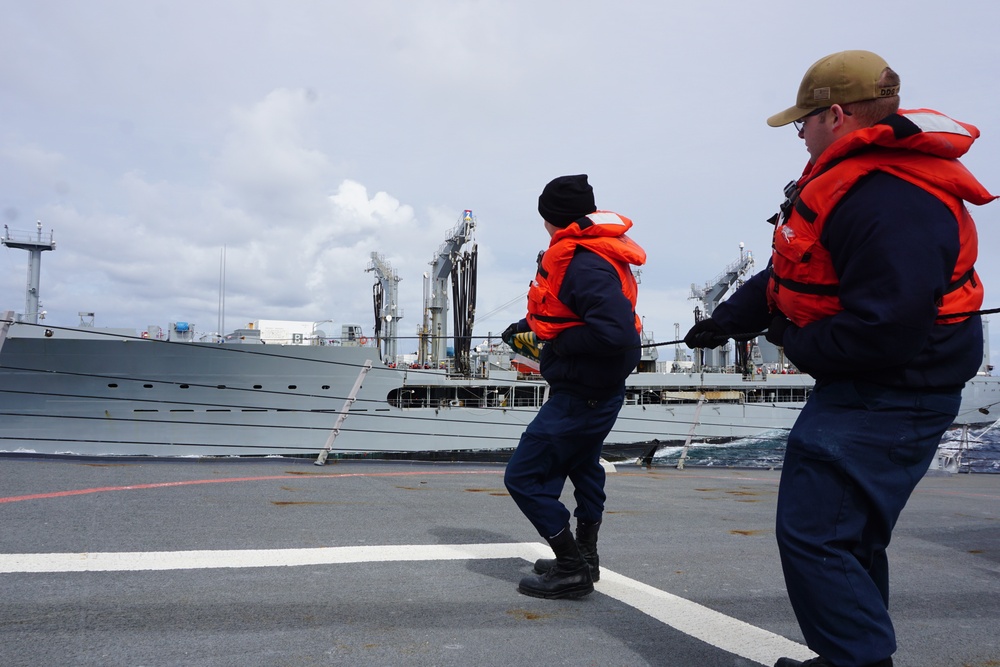 Sailors hold the Phone and Distance (P&amp;D) line steady during a Replenishment At Sea (RAS)