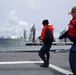 Sailors hold the Phone and Distance (P&amp;D) line steady during a Replenishment At Sea (RAS)