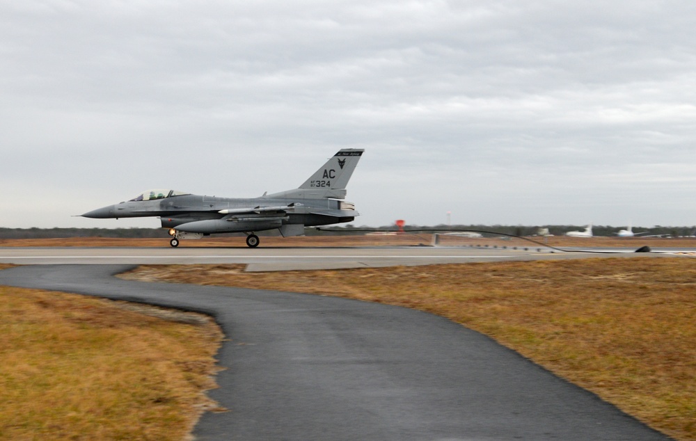 177th Fighter Wing pilots, firefighters, power production and civilian personnel perform active fighter aircraft cable arresting system test