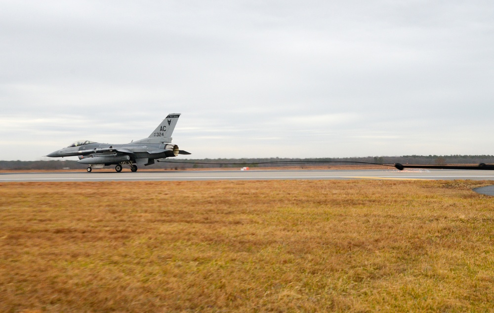 177th Fighter Wing pilots, firefighters, power production and civilian personnel perform active fighter aircraft cable arresting system test