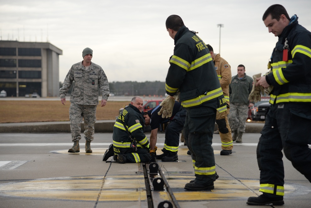 177th Fighter Wing pilots, firefighters, power production and civilian personnel perform active fighter aircraft cable arresting system test