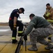 177th Fighter Wing pilots, firefighters, power production and civilian personnel perform active fighter aircraft cable arresting system test