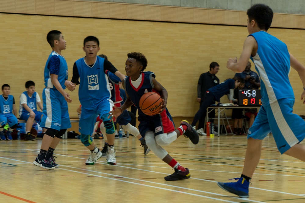 American and Japanese youth compete in friendly basketball tournament