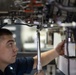 U.S. Sailor torques a jet engine