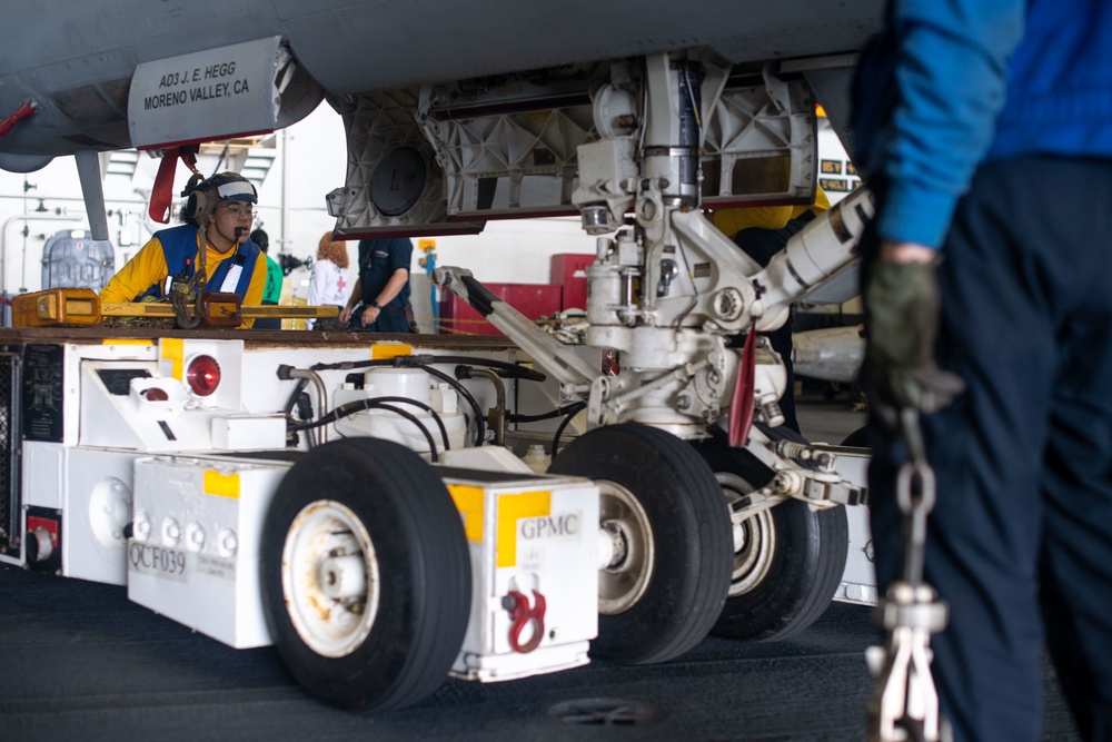 U.S. Sailor operates an aircraft dolly