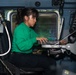 U.S. Sailor conducts a paid-out cable length test on an MH-60R Sea Hawk