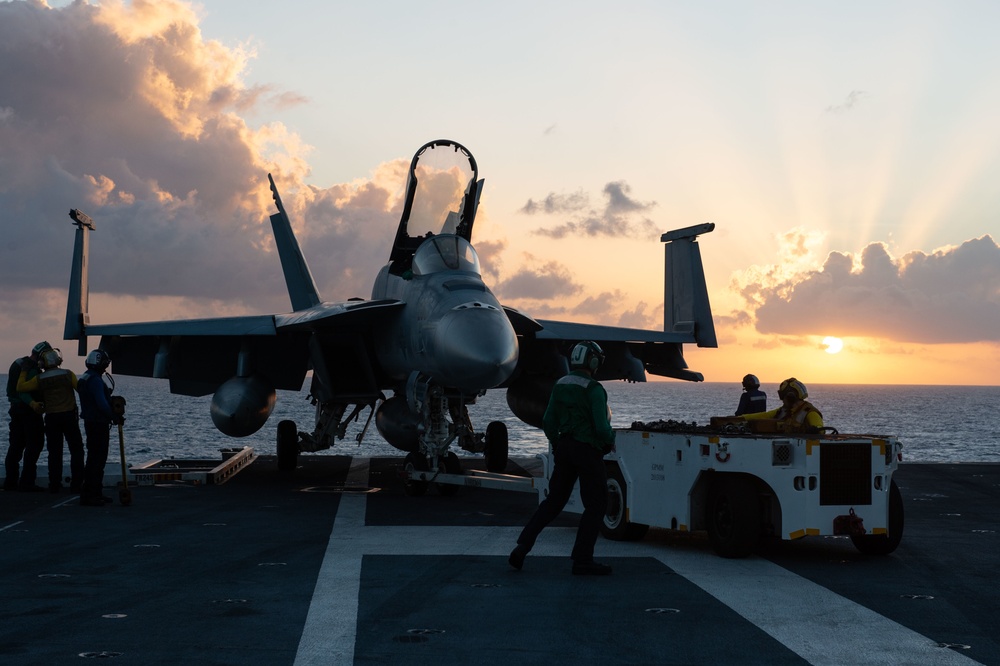 U.S. Sailors  move an F/A-18E Super Hornet