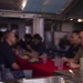 U.S. Navy Sailors prepare to eat their birthday meal aboard the Arleigh Burke-class guided-missile destroyer USS Preble