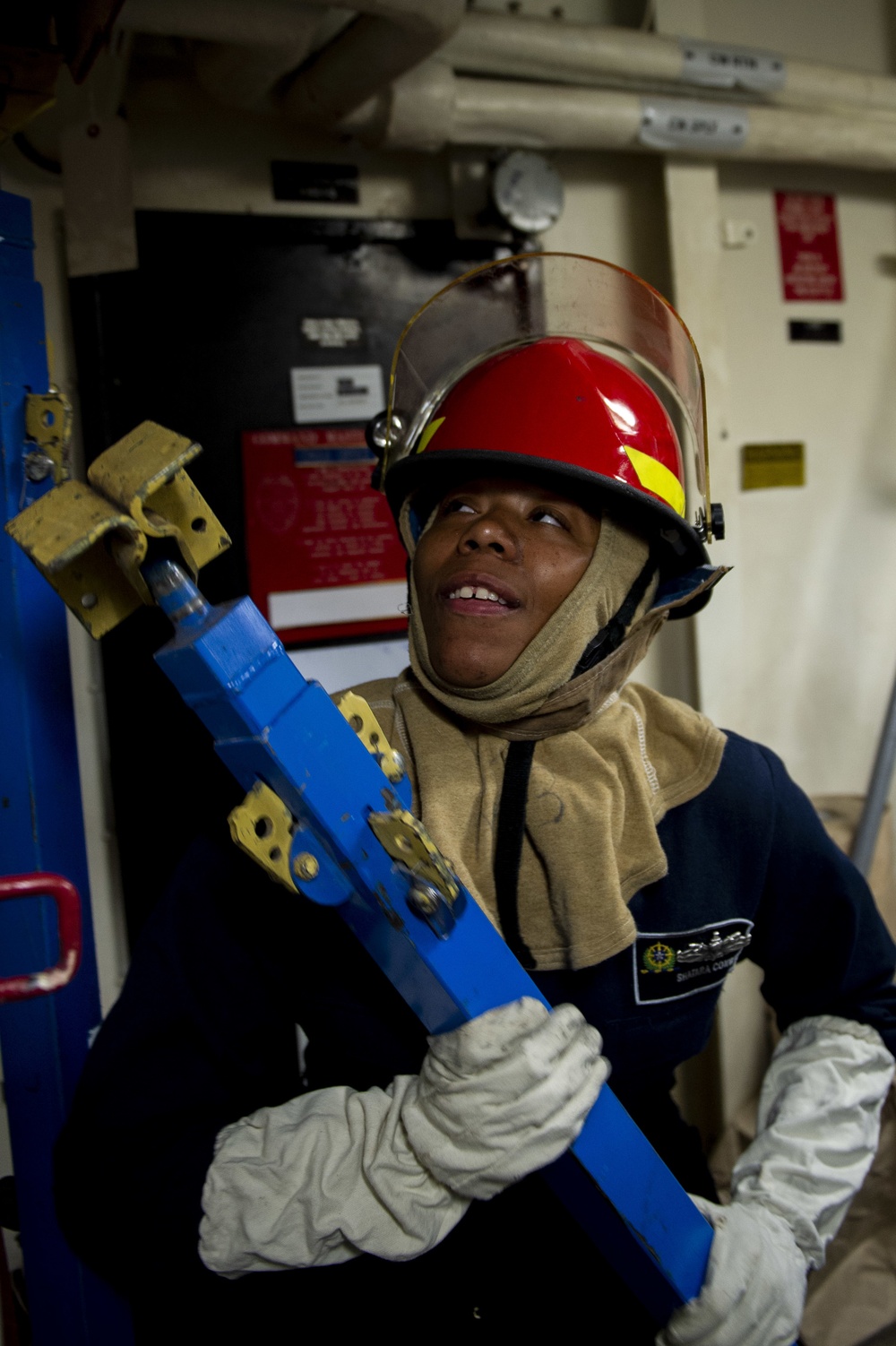 U.S. Navy Personnel Specialist 3rd Class Shatara Conway, from Chicago replaces metal shoring