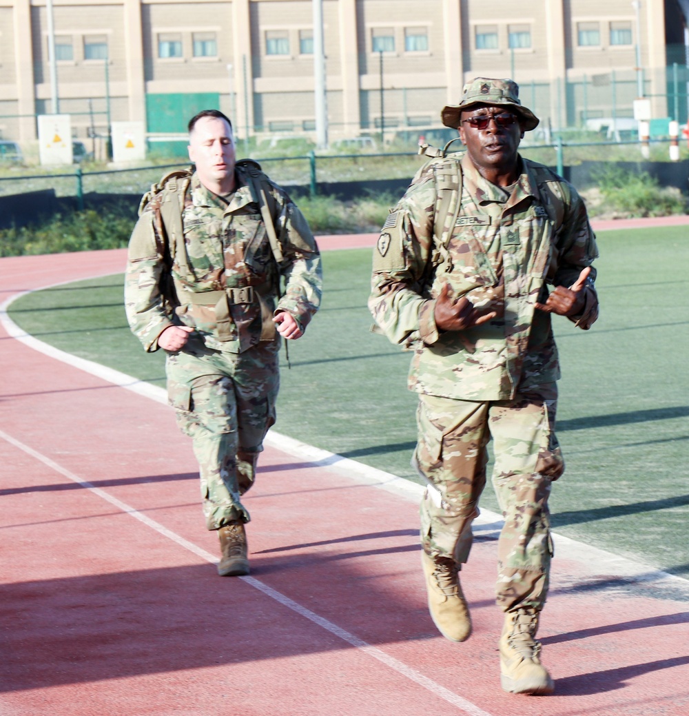 Signal Soldiers participate in Presidents Day 10K Ruck Sack March