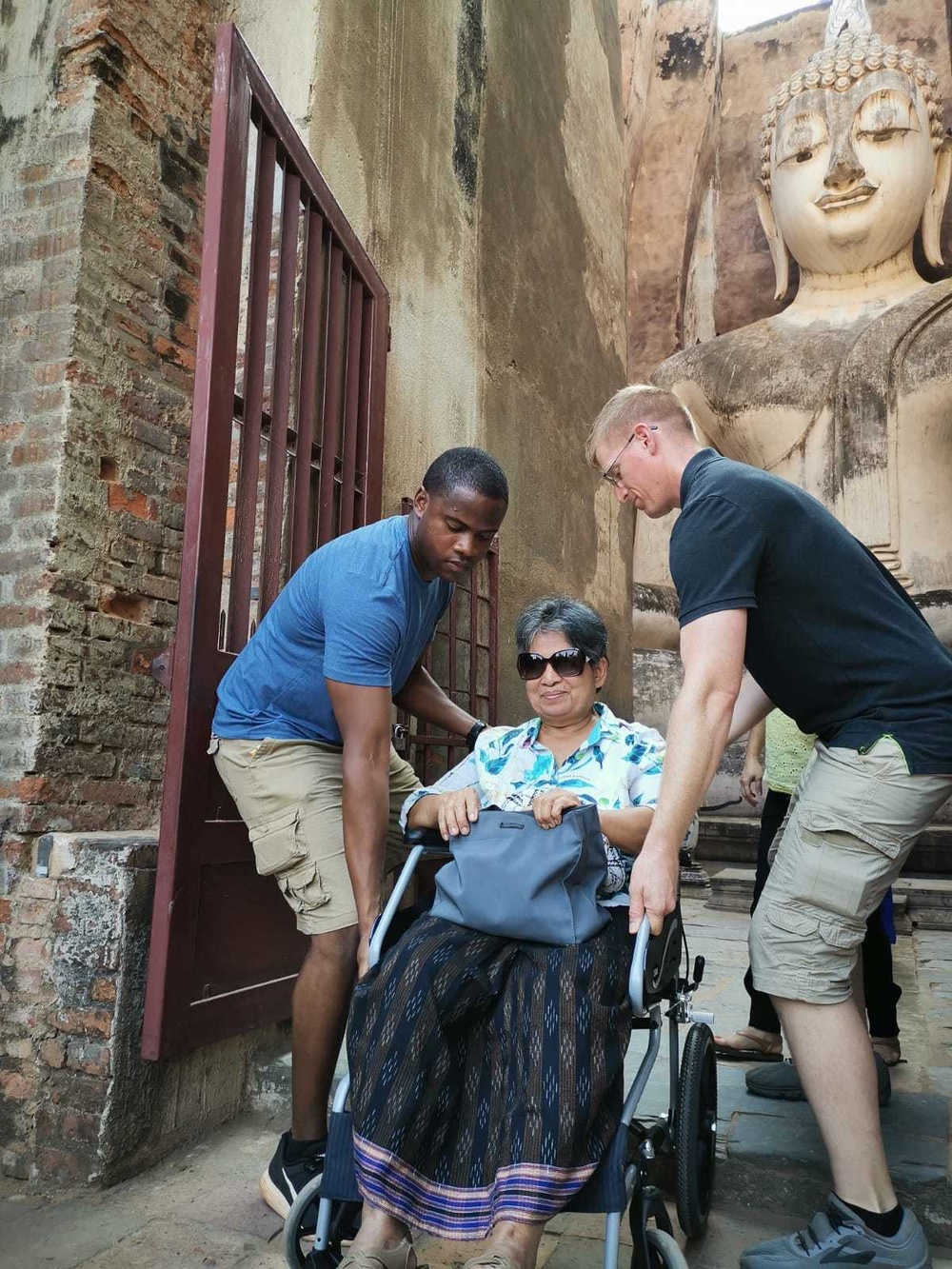 Soldiers help woman enter temple during CG 19