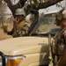 Belgian special operations soldier listens to the Nigerien ground commander give radio orders