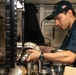 U.S. Sailor assembles a saltwater pump