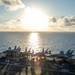 U.S. Sailors transit the flight deck