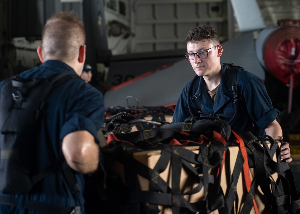 U.S. Sailor handles cargo