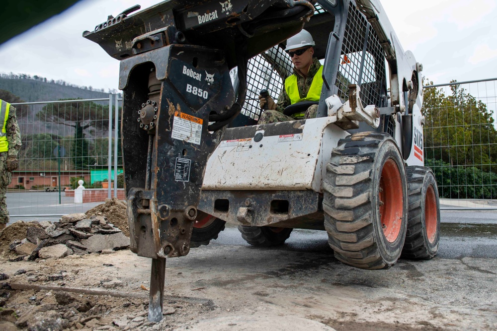 NSA Naples Public Works Department Installs Water Drainage Line At Carney Park