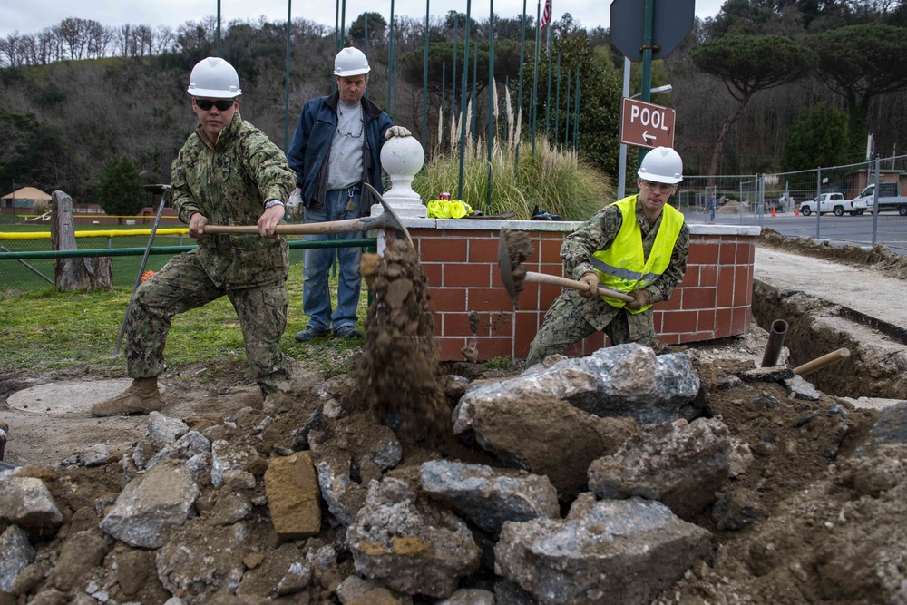 NSA Naples Public Works Department Installs Water Drainage Line At Carney Park