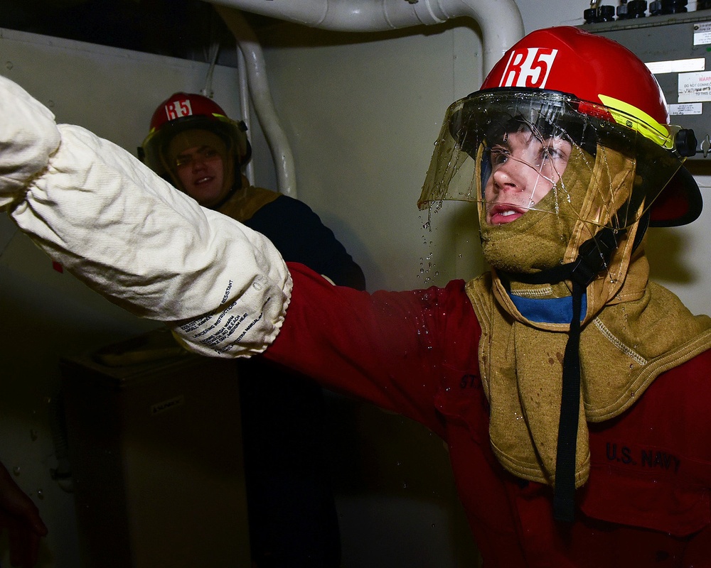 USS Blue Ridge Flying Squad conducts a damage control drill.