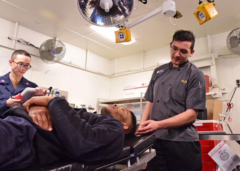 USS Blue Ridge Sailors conduct stretcher bearer training.