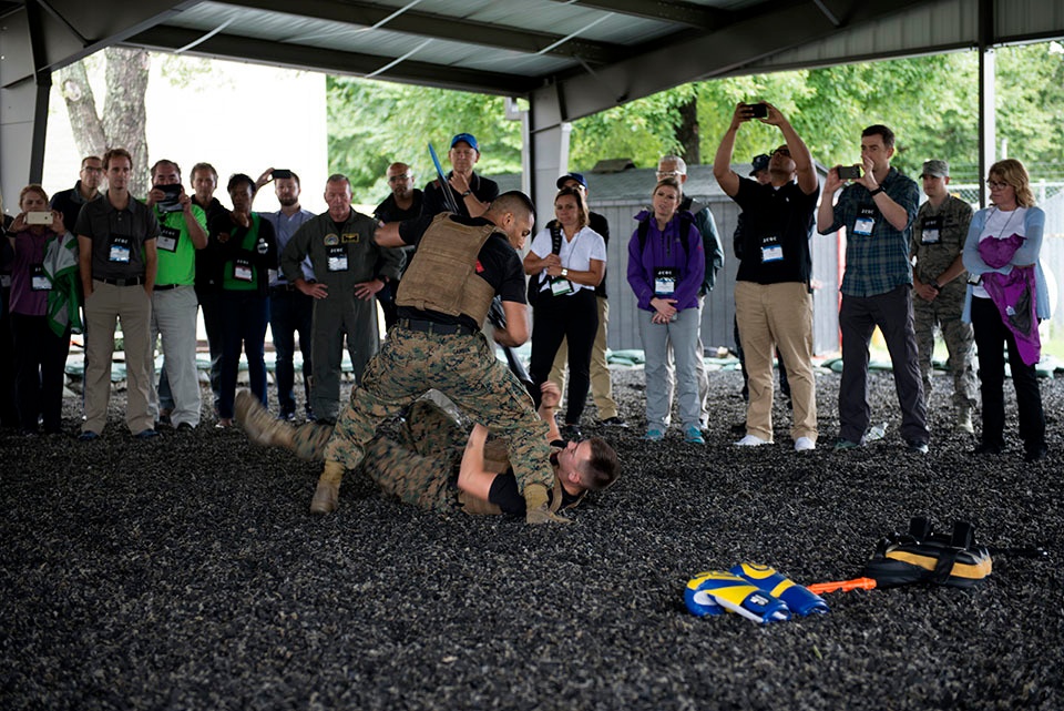 Joint Civilian Orientation Conference 87 Learns what makes the grass grow.