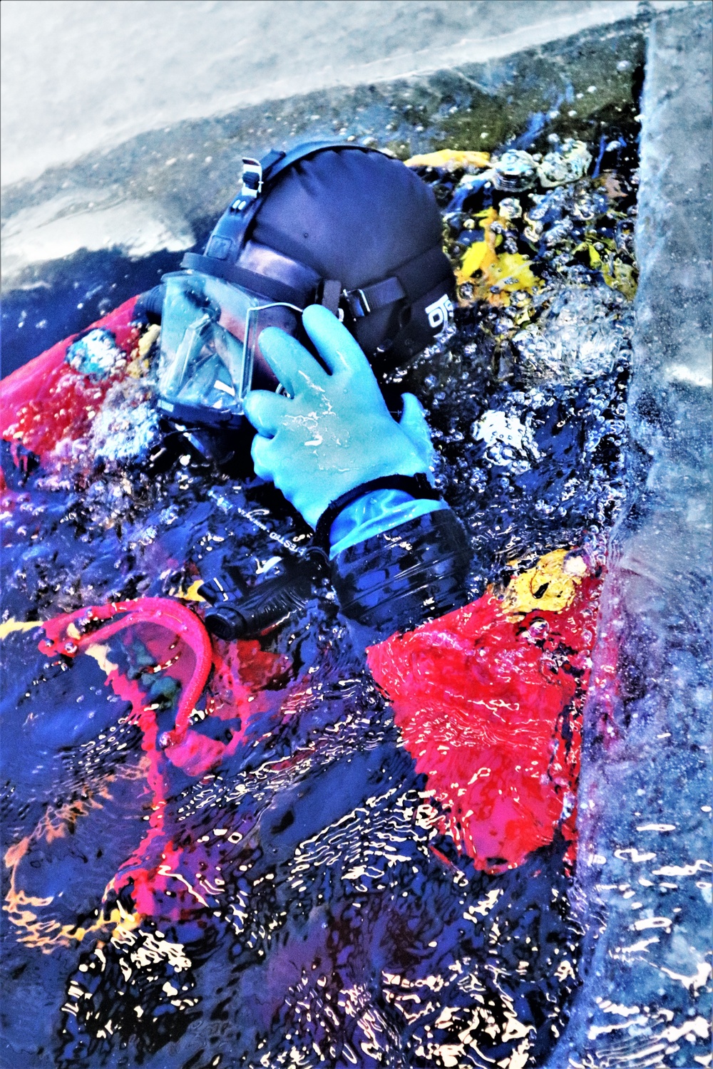 Fort McCoy firefighters practice diving under ice for rescue operations