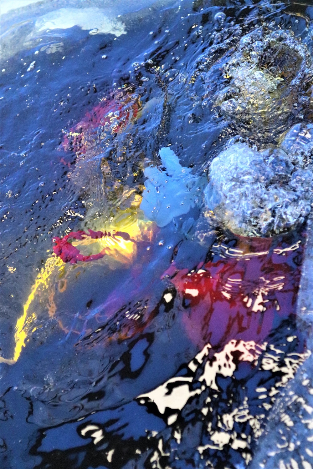 Fort McCoy firefighters practice diving under ice for rescue operations