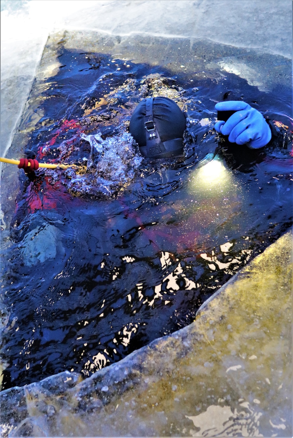 Fort McCoy firefighters practice diving under ice for rescue operations