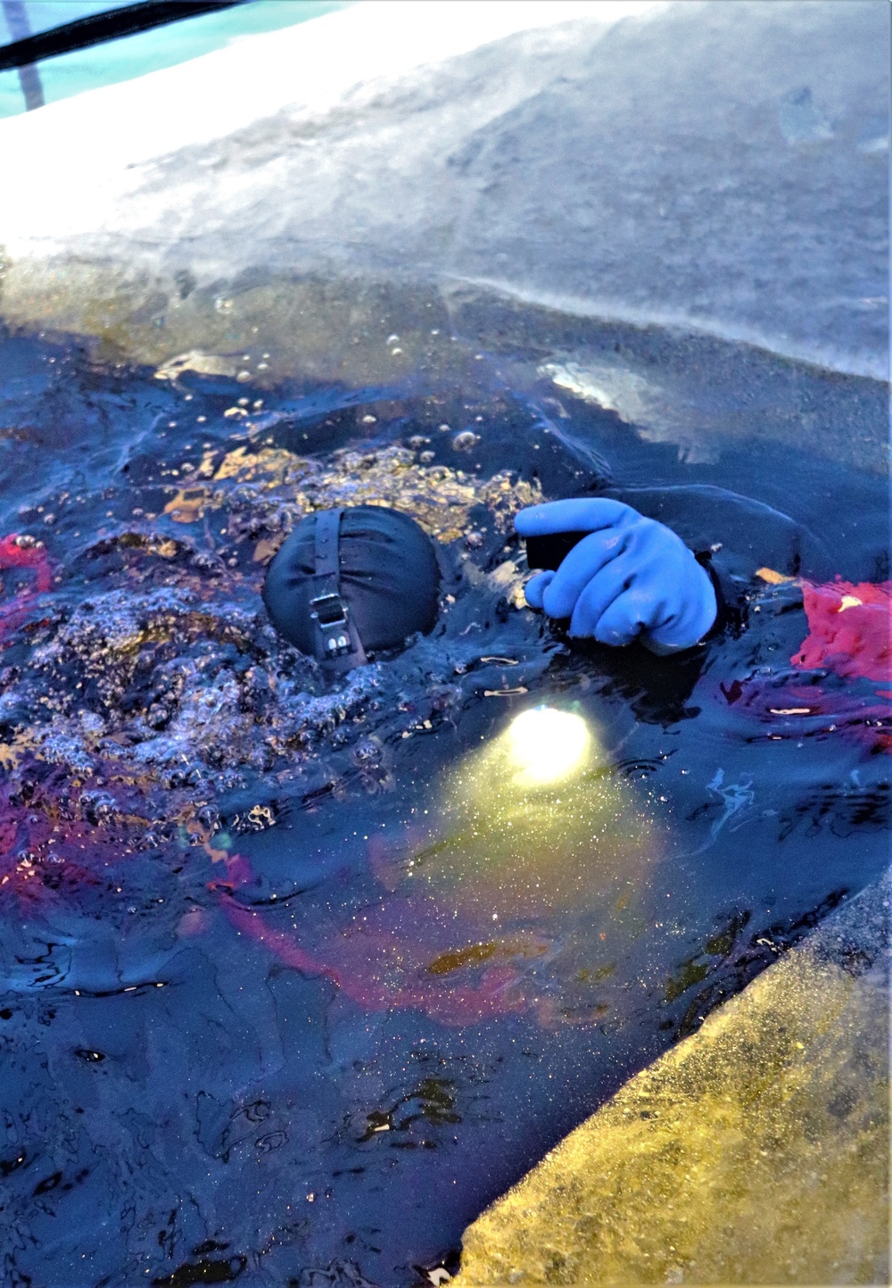 Fort McCoy firefighters practice diving under ice for rescue operations