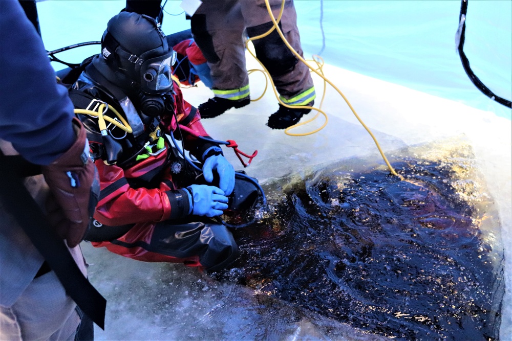 Fort McCoy firefighters practice diving under ice for rescue operations