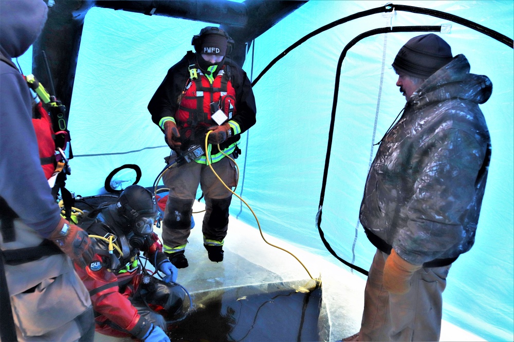 Fort McCoy firefighters practice diving under ice for rescue operations