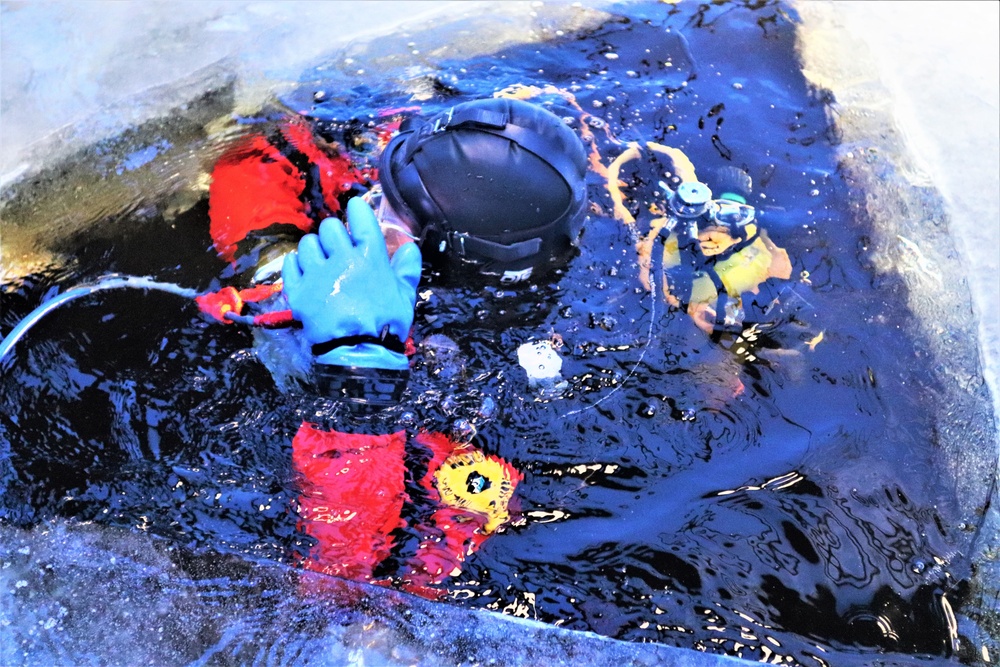 Fort McCoy firefighters practice diving under ice for rescue operations