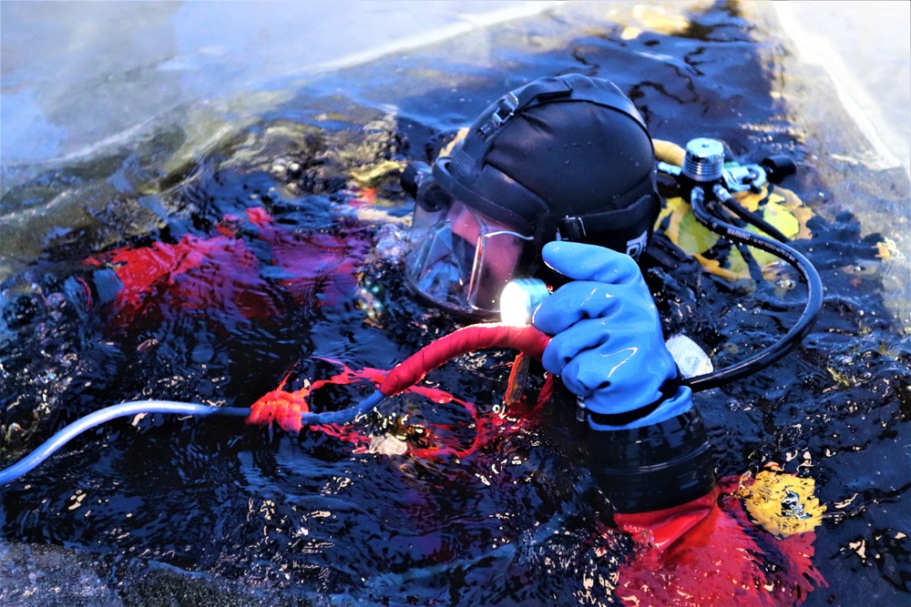 Fort McCoy firefighters practice diving under ice for rescue operations