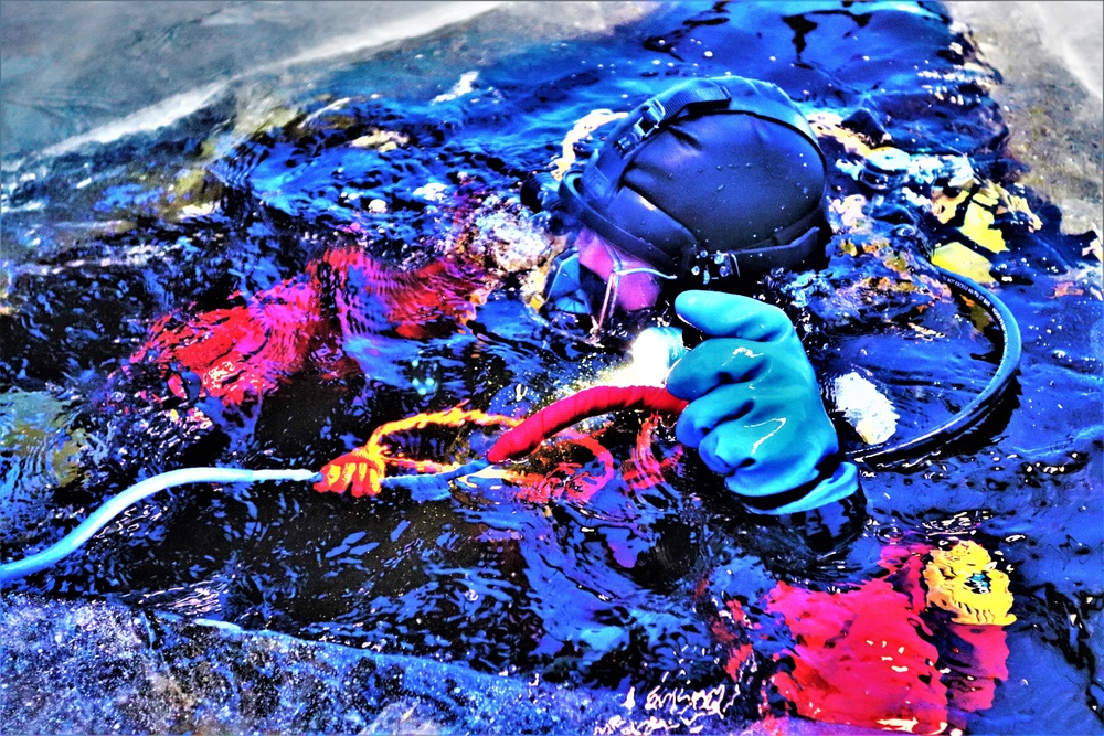 Fort McCoy firefighters practice diving under ice for rescue operations
