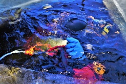 Fort McCoy firefighters practice diving under ice for rescue operations